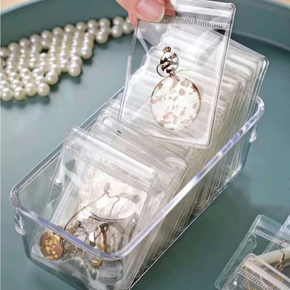 Jewelry box organizer tray with clear storage zipped bags. Perfect for drawers